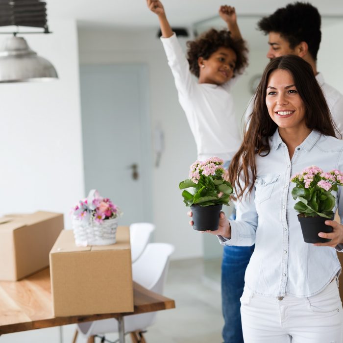 Cute family moving into their new home